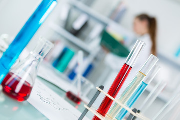 test tubes in rack on laboratory background