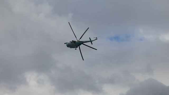 Russian army Mi-8 helicopter in action against cloudy sky