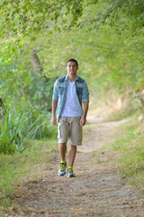 man walking at forest trail