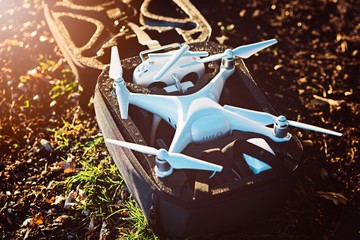 White drone quadcopter in backpack