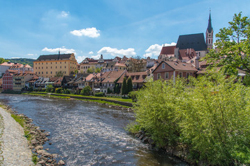Cesky Krumlov city view in middle of the sunny day with river in town