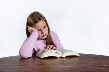 Bored girl with book on white background
