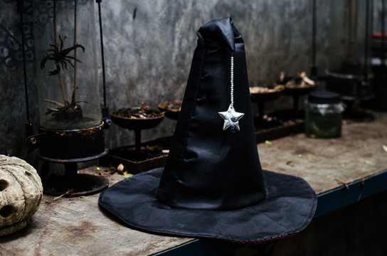 witch hat on wooden table. Halloween holiday concept.