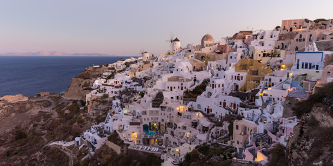 Obraz premium World famous Oia village or Ia at sunrise, Santorini island, Greece.