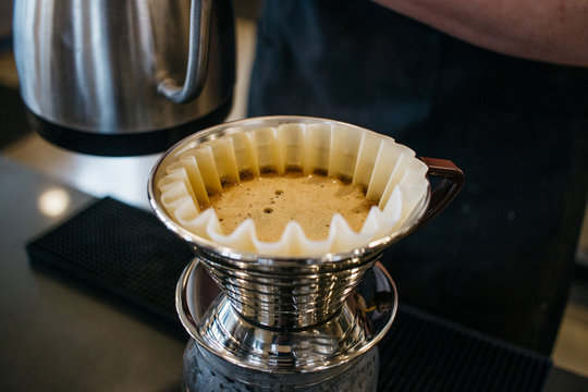making a pour over coffee at cafe