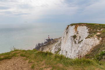 Fototapeta na wymiar Beachy Head cliff down to the lighthouse when the tide is out.