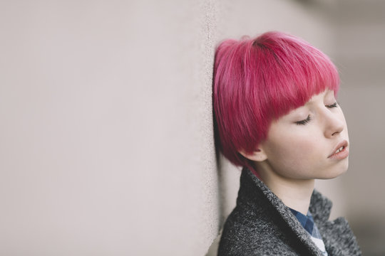 girl with pink hair .