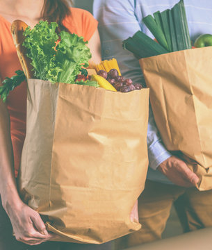 Beautiful Woman Holding A Paper Bag With Food Close-up