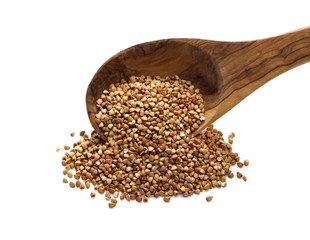 Buckwheat in wooden spoon, isolated on white background