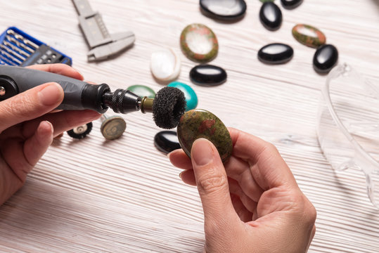 Jeweler working with dremel