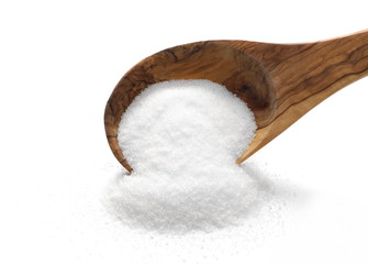 White sugar pile in wooden spoon isolated on white background 