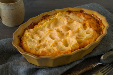 Classic homemade Shepherd's Pie in the casserole dish. Selective Focus.
