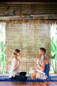 Therapist guiding the client in tropical retreat center to EFT (Emotional Freedom Technique)