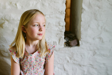 Portrait of a little girl looking away from camera