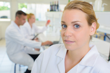 Fototapeta premium Portrait of woman in white coat