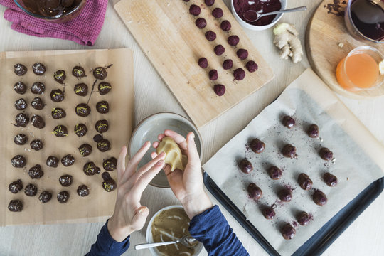 Hands kneading marzipan for homemade candy