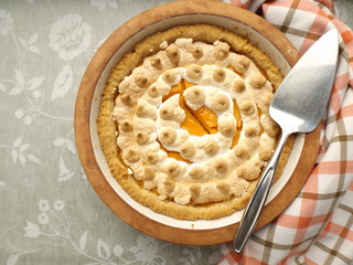 Pie with pumpkin filling, covered with meringue.