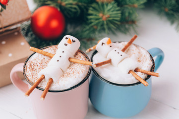 mugs with hot chocolate in which the men from the zyphira relax. concept of a couple