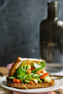 Toasted vegetarian sandwich on a plate.