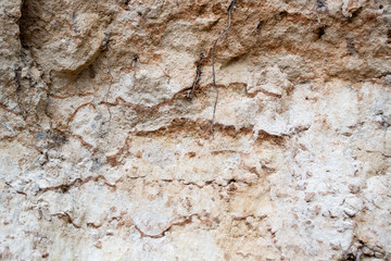 Naklejka premium Bright yellow orange background with layers of sand and clay