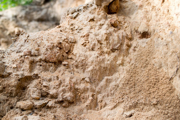 Bright yellow orange background with layers of sand and clay