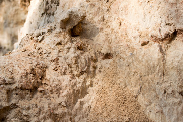 Bright yellow orange background with layers of sand and clay