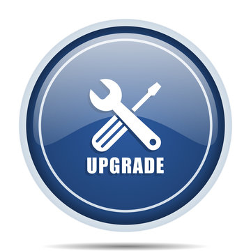 Upgrade blue round web icon. Circle isolated internet button for webdesign and smartphone applications.