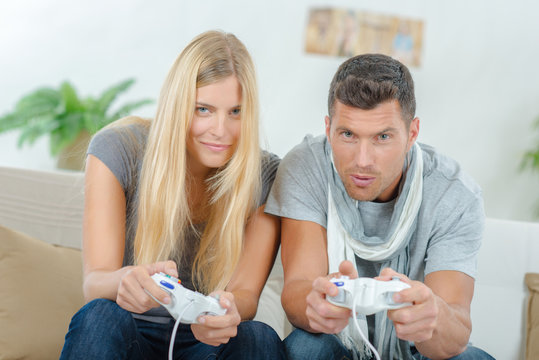 Competitive couple playing video games