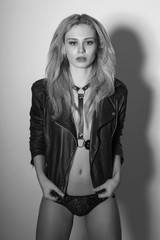 Blonde girl in leather jacket, monochrome shot