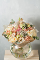 Flower composition on a gray background. Wedding and Festive decor. Bouquet from spring flowers. copy space