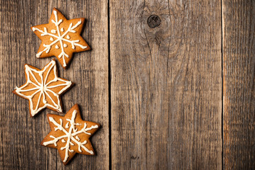 Christmas gingerbread cookies on wooden background