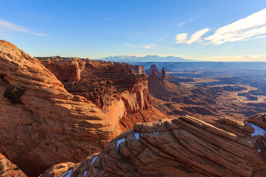 The late afternoon sun beats down on the red landscape of Canyonlands National Park, Utah