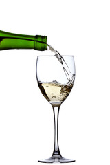 white wine poured from bottle to glass