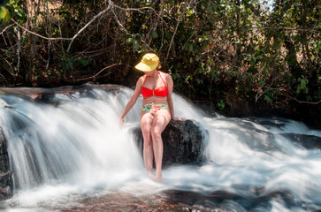 Mature Lady Enjoying a Beautiful Waterfall
