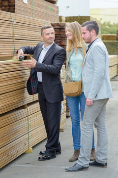 couple checking wood stored