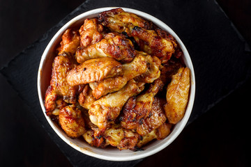 Chicken legs in a bucket.