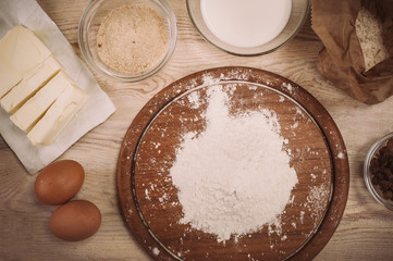 Dough recipe ingredients on vintage rural wood kitchen table