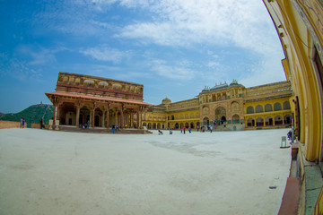 Some tourist visiting the beautiful old palace, in Amber Fort, located in Amer, Rajasthan, India. Amer is a town with an area of 4 square kilometres located 11 kilometres from Jaipur, the capital of