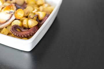 Baked Octopus with Potatoes. Space for text.