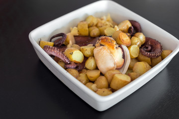 Plate with Baked Octopus with Potatoes.