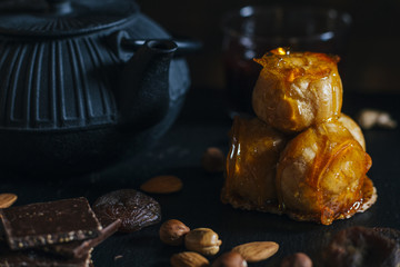 Cream puff cake with caramel icing and pieces of dark chocolate. Traditional french and Italian pastry. Delicious dessert. Toned