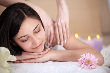 Fototapeta na wymiar Spa Woman. Close-up of a Beautiful Woman Getting Spa Treatment. Massage