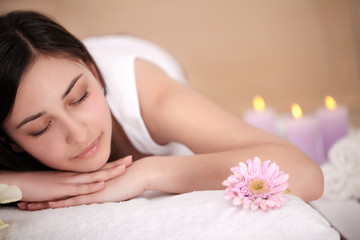 Obraz na płótnie Canvas Body Care. Spa Woman. Beauty Treatment Concept. Beautiful Healthy Caucasian Girl Relaxing On Massage Table Before Hand Massage On Relaxed Back In Health And Spa Salon. Skin Care, Wellness, Lifestyle