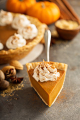 Pumpkin pie with whipped cream