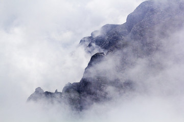 Landscape from Bucegi Mountains, part of Southern Carpathians in Romania in a very foggy day
