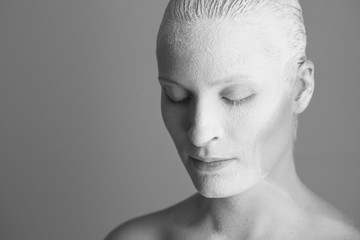 Portrait of young woman with flour
