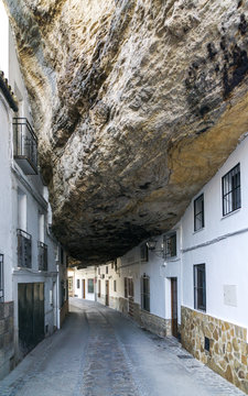 Rock between houses in Setenil de las Bodegas village