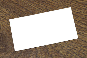 Photo of blank business cards on a wooden background.