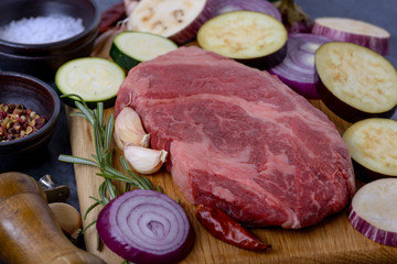 Closeup raw meat with vegetables