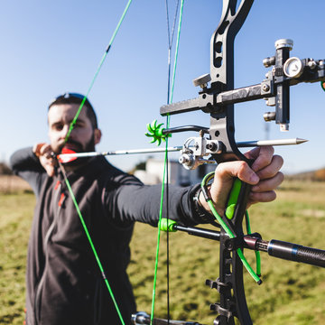 Male Archer Aiming with Professional Compound Bow
